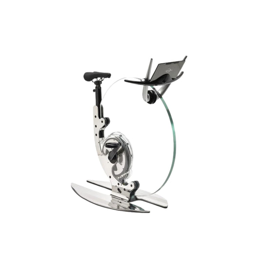 45 degree angle view of a luxurious gym equipment, Italian design exercise bike made of crystal glass. Ciclotte Teckell - Glass Exercise Bike